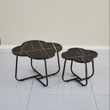 Load image into Gallery viewer, Two black marble-patterned side tables on a white floor with a beige wall background.
