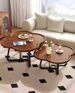 Living room with a beige sofa, wooden coffee table, and decorative items.