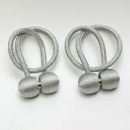 Magnetic curtain tieback
